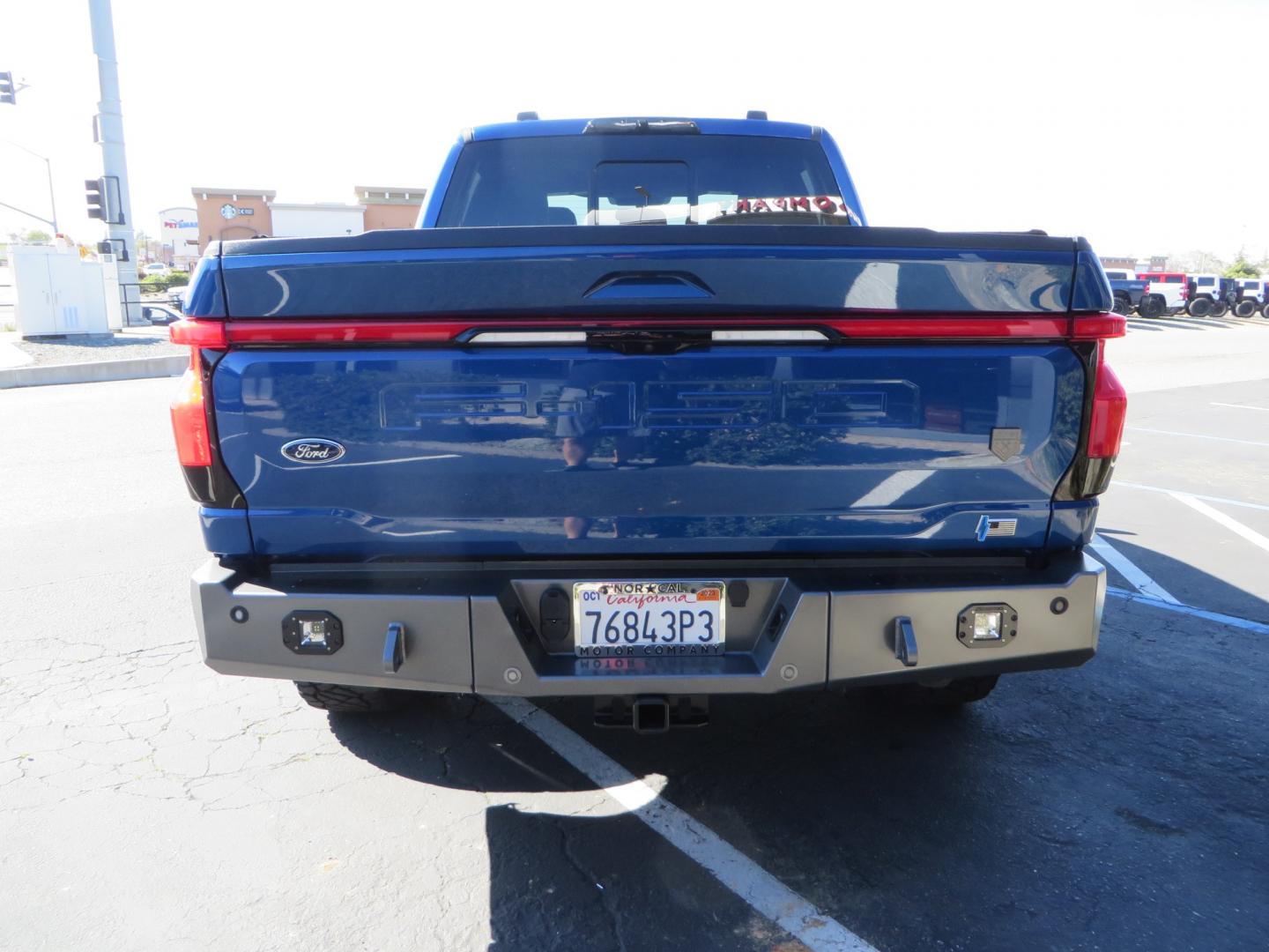 2022 BLUE /BLACK Ford F-150 Lariat Crew Cab 4WD (1FT6W1EV6NW) , located at 2630 Grass Valley Highway, Auburn, CA, 95603, (530) 508-5100, 38.937893, -121.095482 - Tired of gas prices and still want to look cool? Check out this Ford Lightning featuring a RC level kit, Nitto Ridge Grappler tires, Fuel Rebel wheels, Sinister front and rear bumpers, Baja Designs leds, Rigid Industries Leds, Bakflip F1, and window tint. - Photo#5